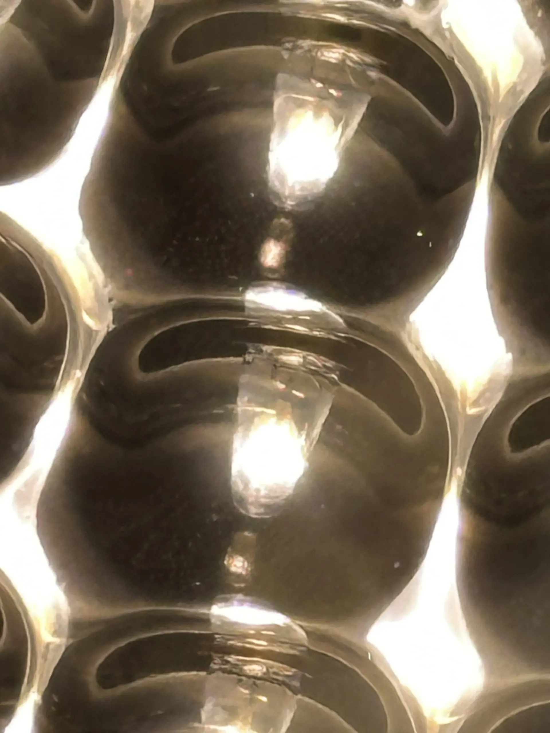 Close-up photograph showing surface details across adjacent Nano Grow Light reflector cells; not an SEM micrograph